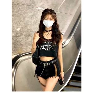 Black ripped jean shorts with belt